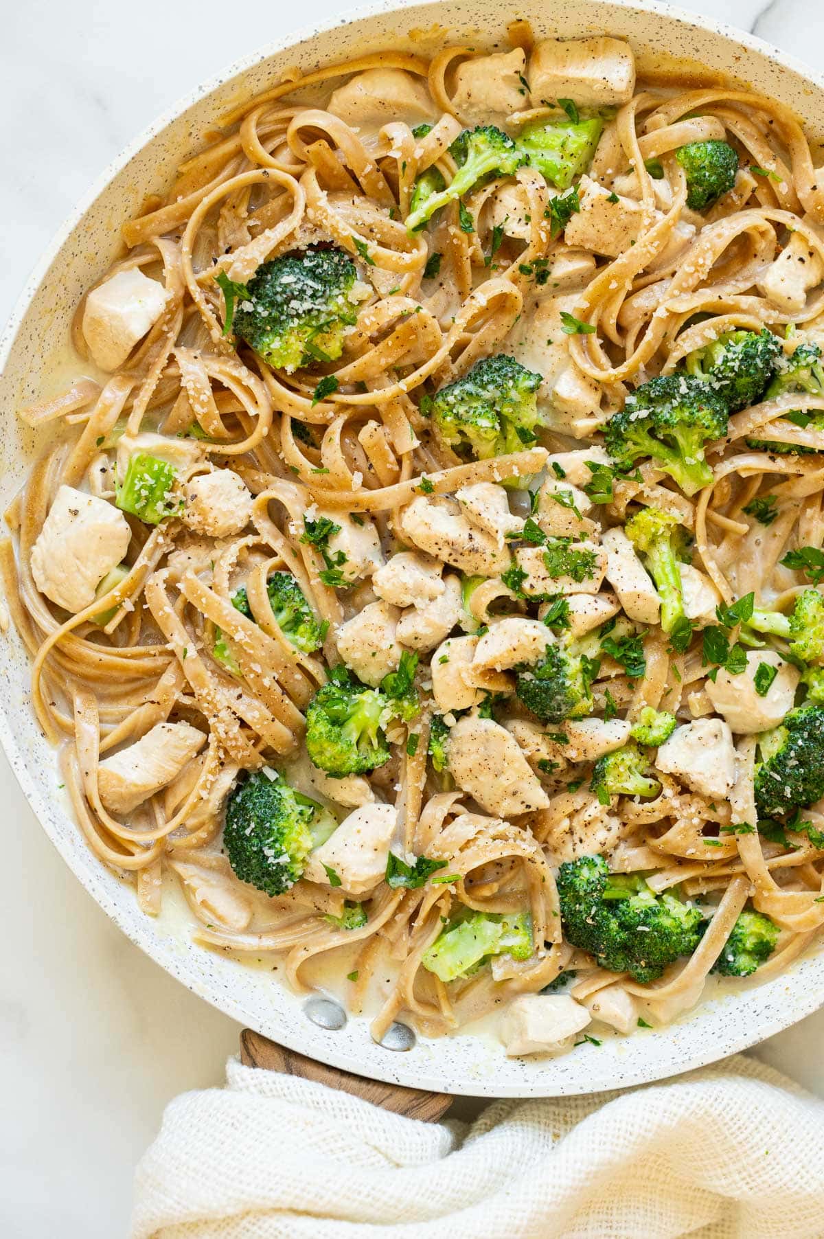 Healthy chicken alfredo in a skillet.