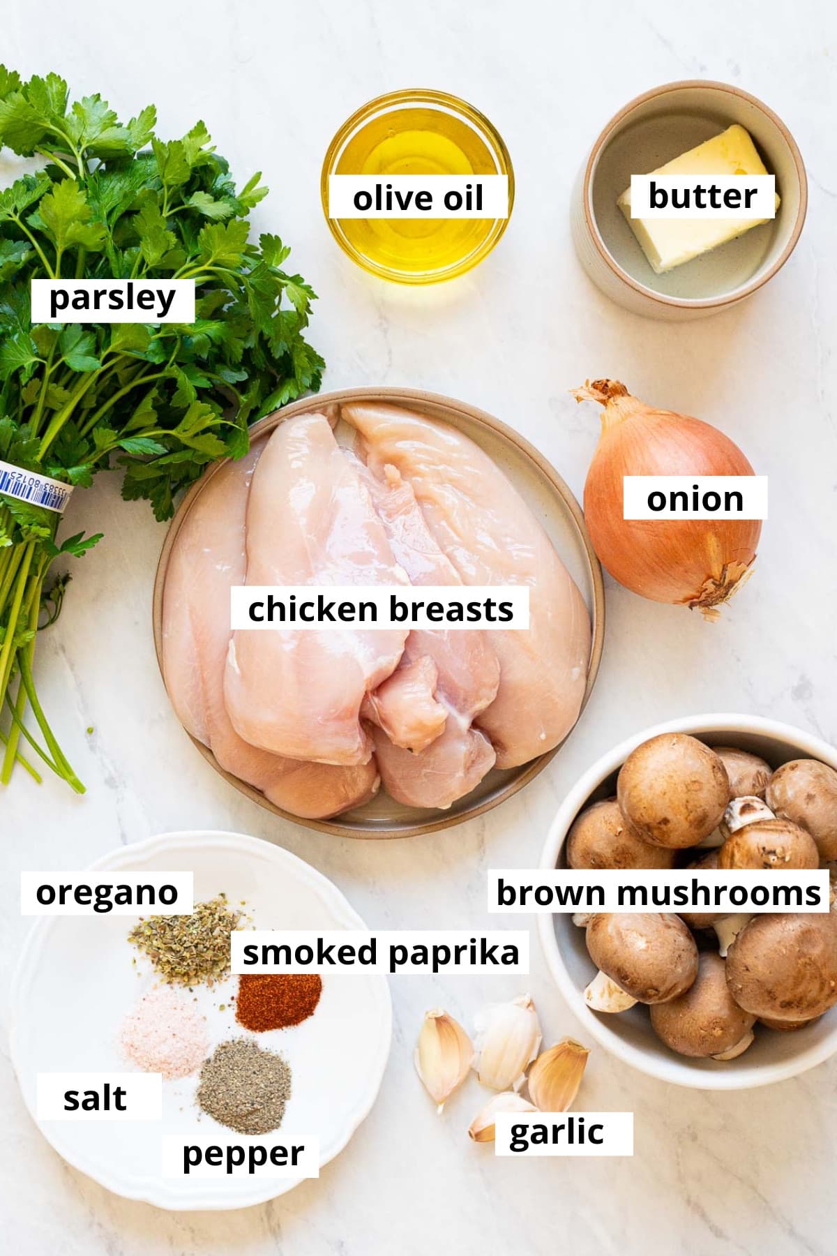 Chicken breasts, brown mushrooms, onion, garlic, parsley, olive oil, butter, oregano, smoked paprika, salt and pepper.