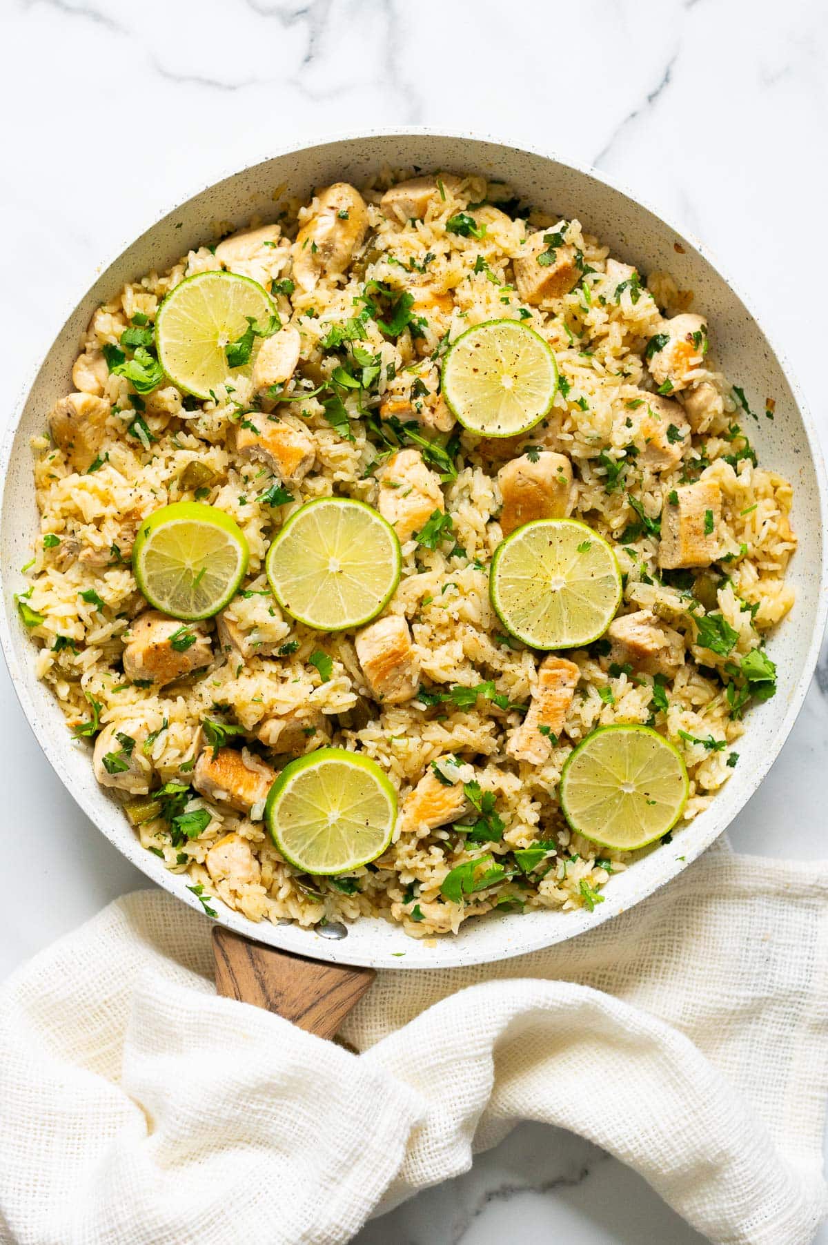 Cilantro lime chicken rice skillet with linen towel around it.