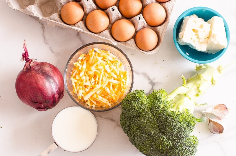 Eggs, feta, cheddar, milk, red onion, broccoli and garlic.