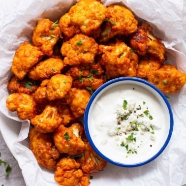 Air fryer buffalo cauliflower with blue cheese dip.