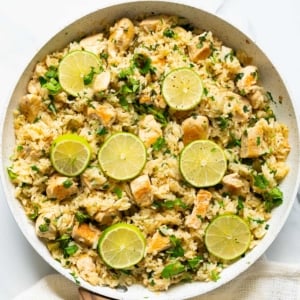 Cilantro lime chicken rice skillet with linen towel around it.