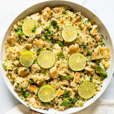 Cilantro lime chicken rice skillet with linen towel around it.