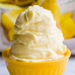 Dole whip served in yellow bowl.