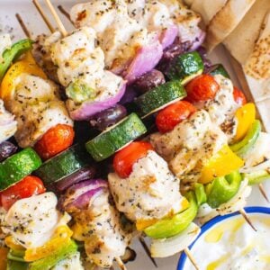 Greek chicken kabobs on skewers.