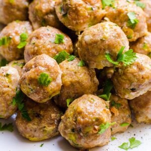 Healthy turkey meatballs garnished with parsley.