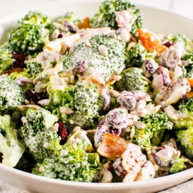 Healthy broccoli salad in white bowl.