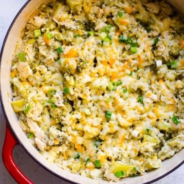 Healthy chicken and rice Casserole in red Dutch oven.