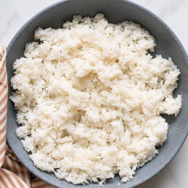 Instant pot long grain white rice in a blue bowl.