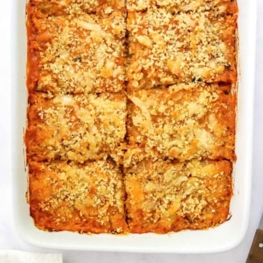Spaghetti squash casserole in baking dish cut into serving sizes.