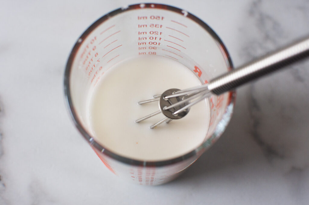 slurry with whisk in glass cup