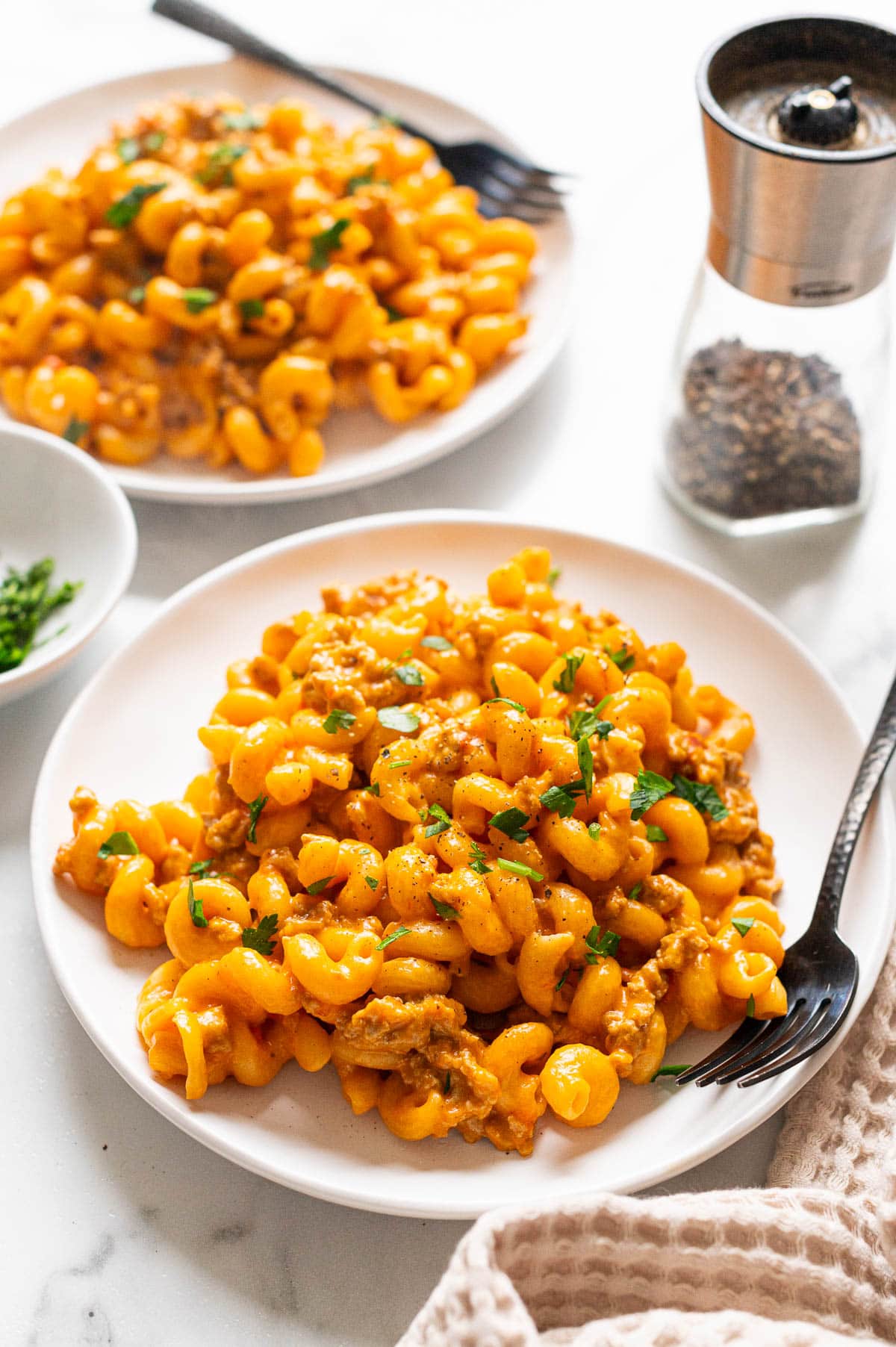 Ground Turkey Hamburger Helper served on plates with forks.