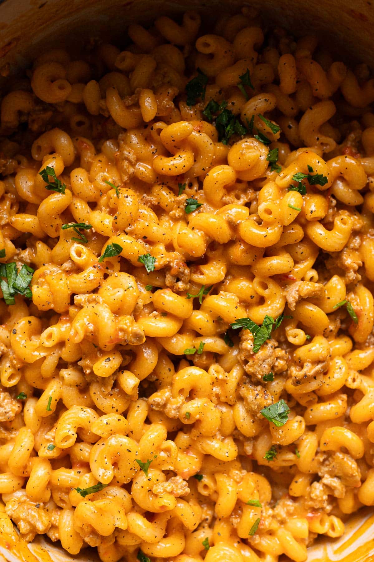 Close up of you of healthier Hamburger Helper garnished with parsley and ground black pepper.