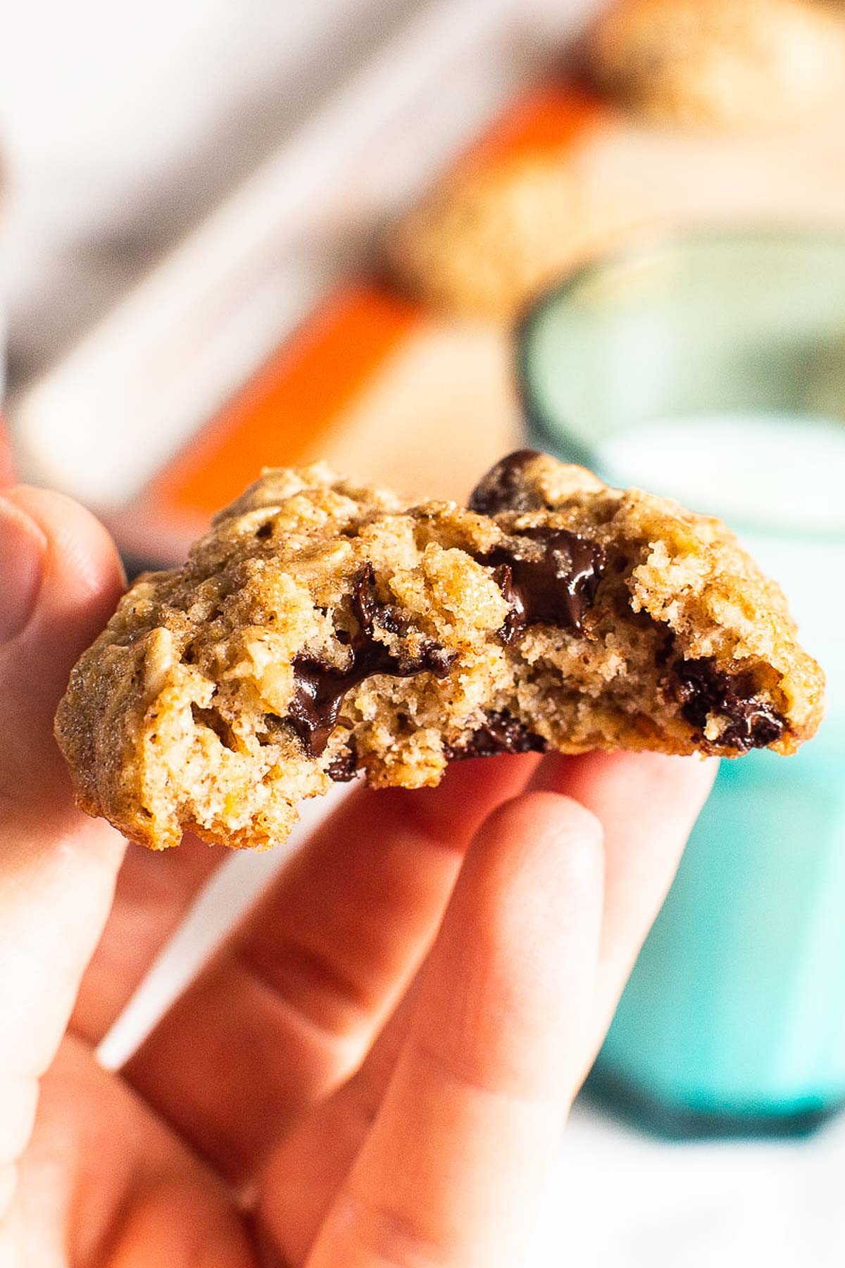 Person holding a cookie showing texture inside.