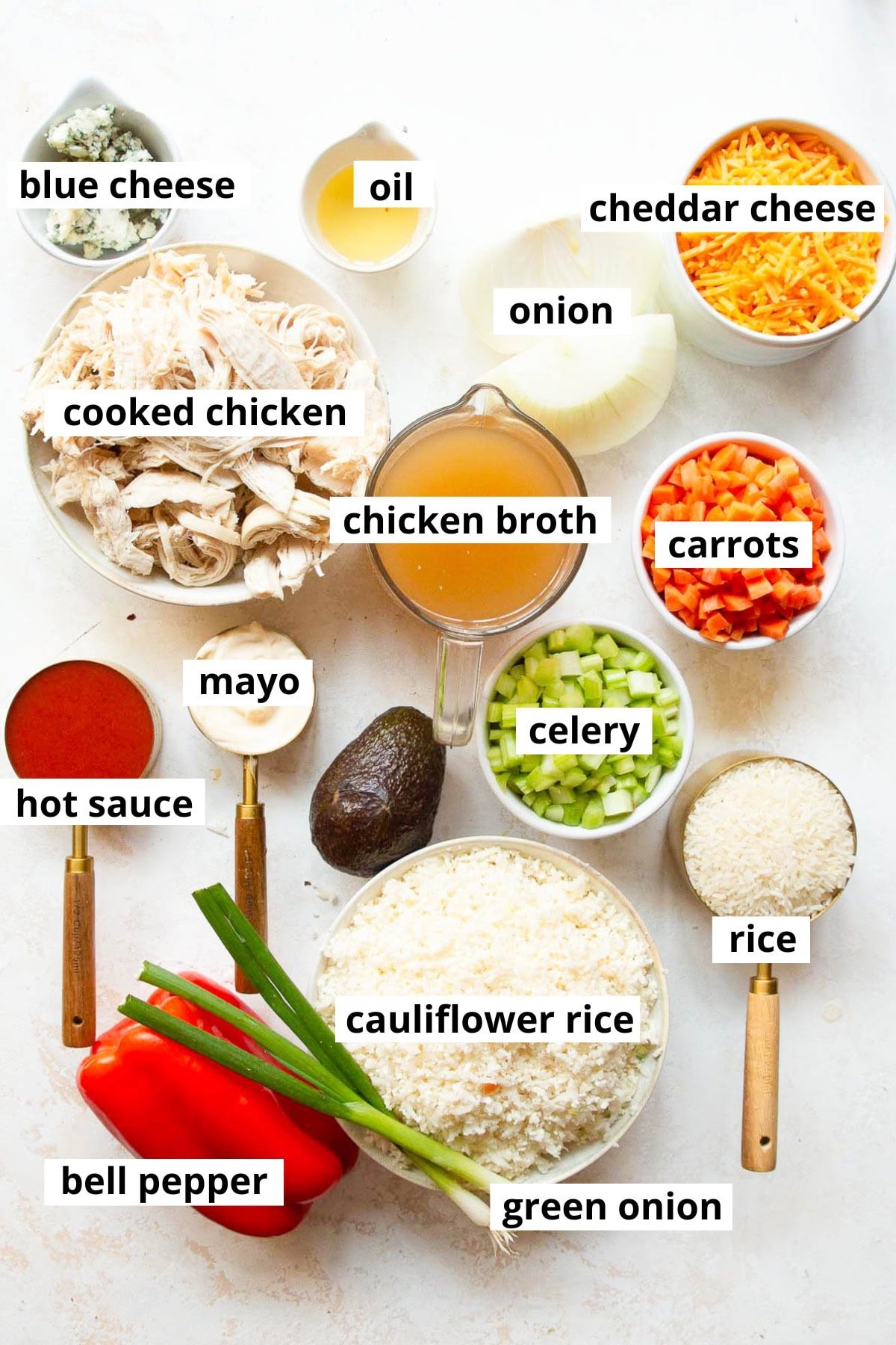 Cooked chicken, onion, carrots, celery, bell pepper, oil, blue cheese, chicken broth, mayo, hot sauce, rice, cauliflower rice, green onion.