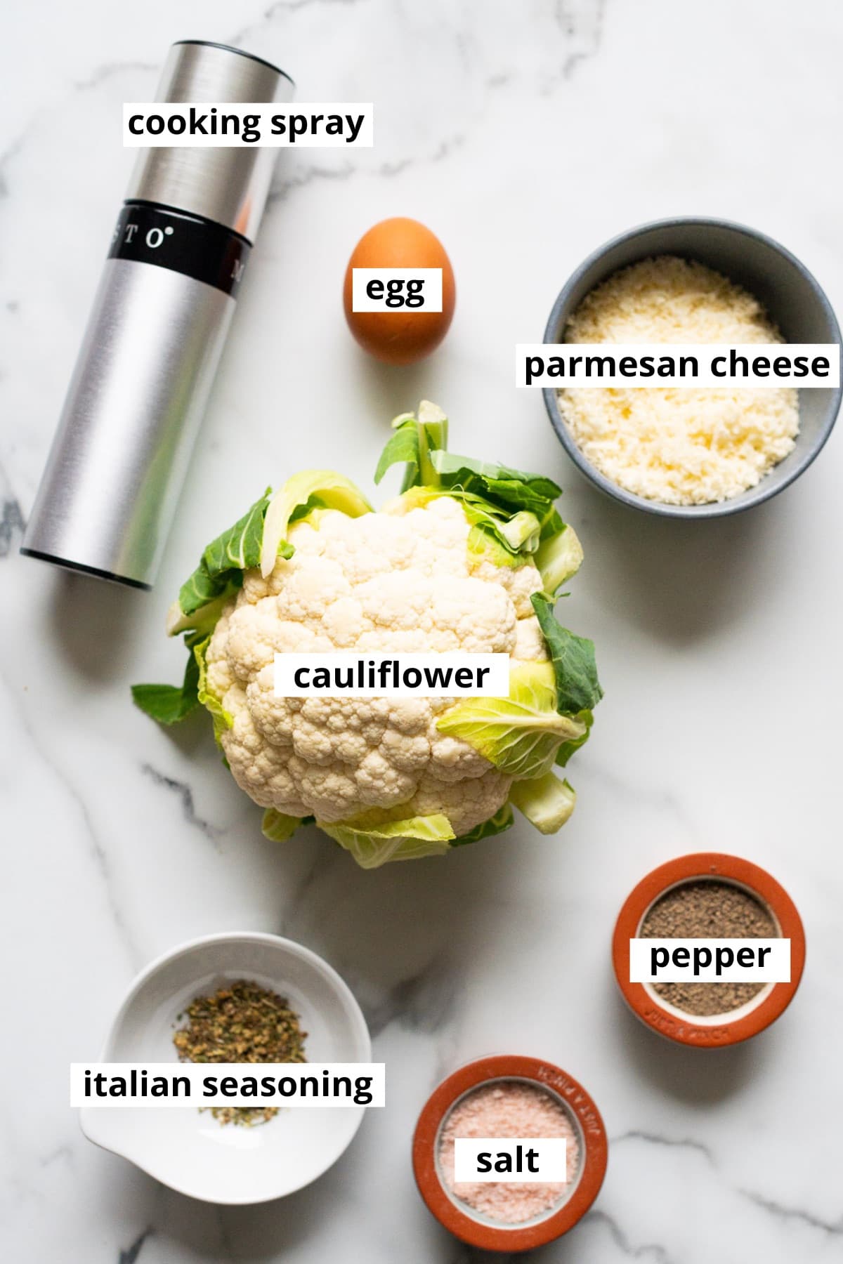 Head of cauliflower, parmesan cheese, egg, cooking spray, Italian seasoning, salt and pepper.
