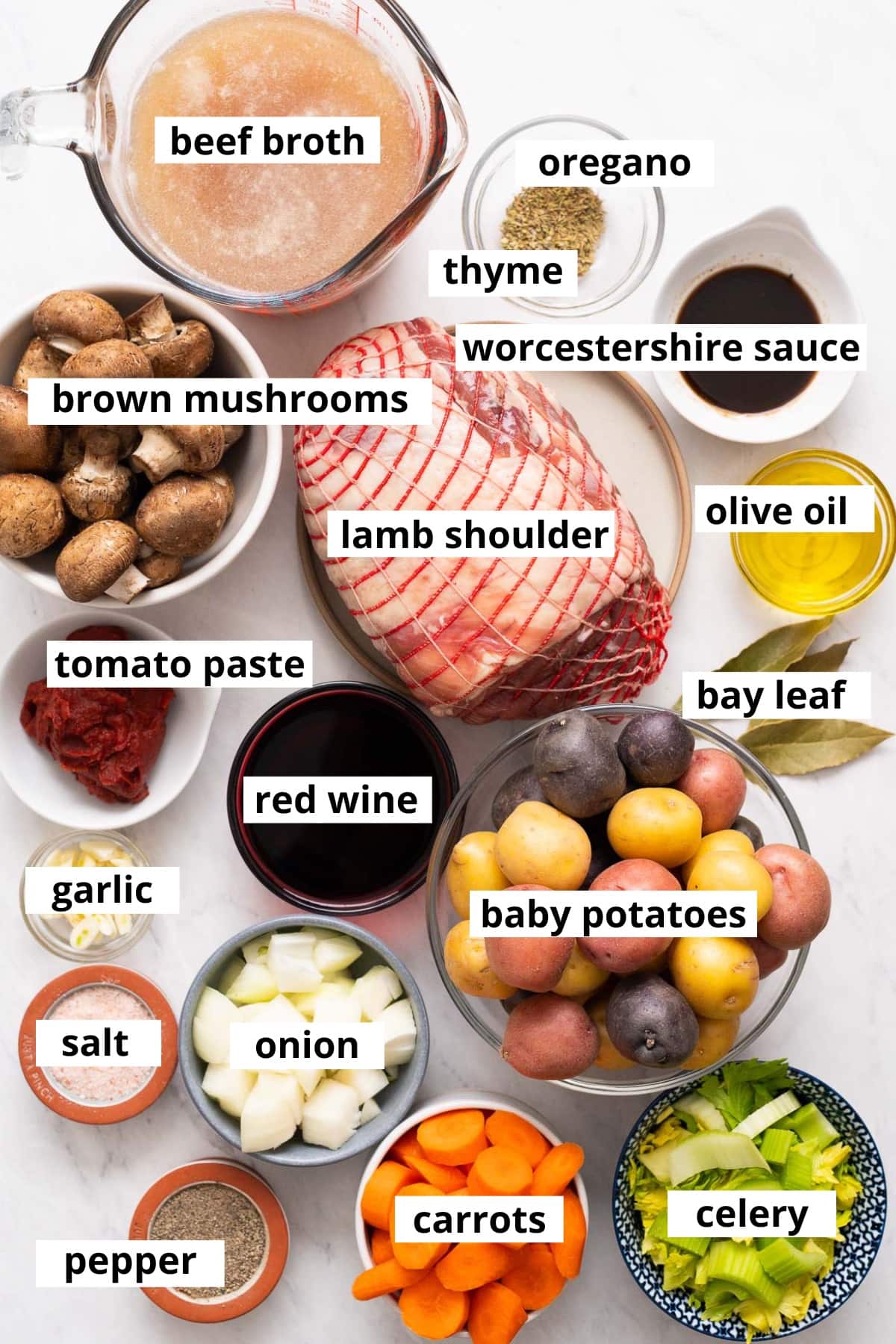 Lamb shoulder, baby potatoes, mushrooms, beef broth, oregano, time, Worcestershire, oil, tomato paste, red wine, bay leaf, garlic, onion, carrots, celery, salt and pepper.