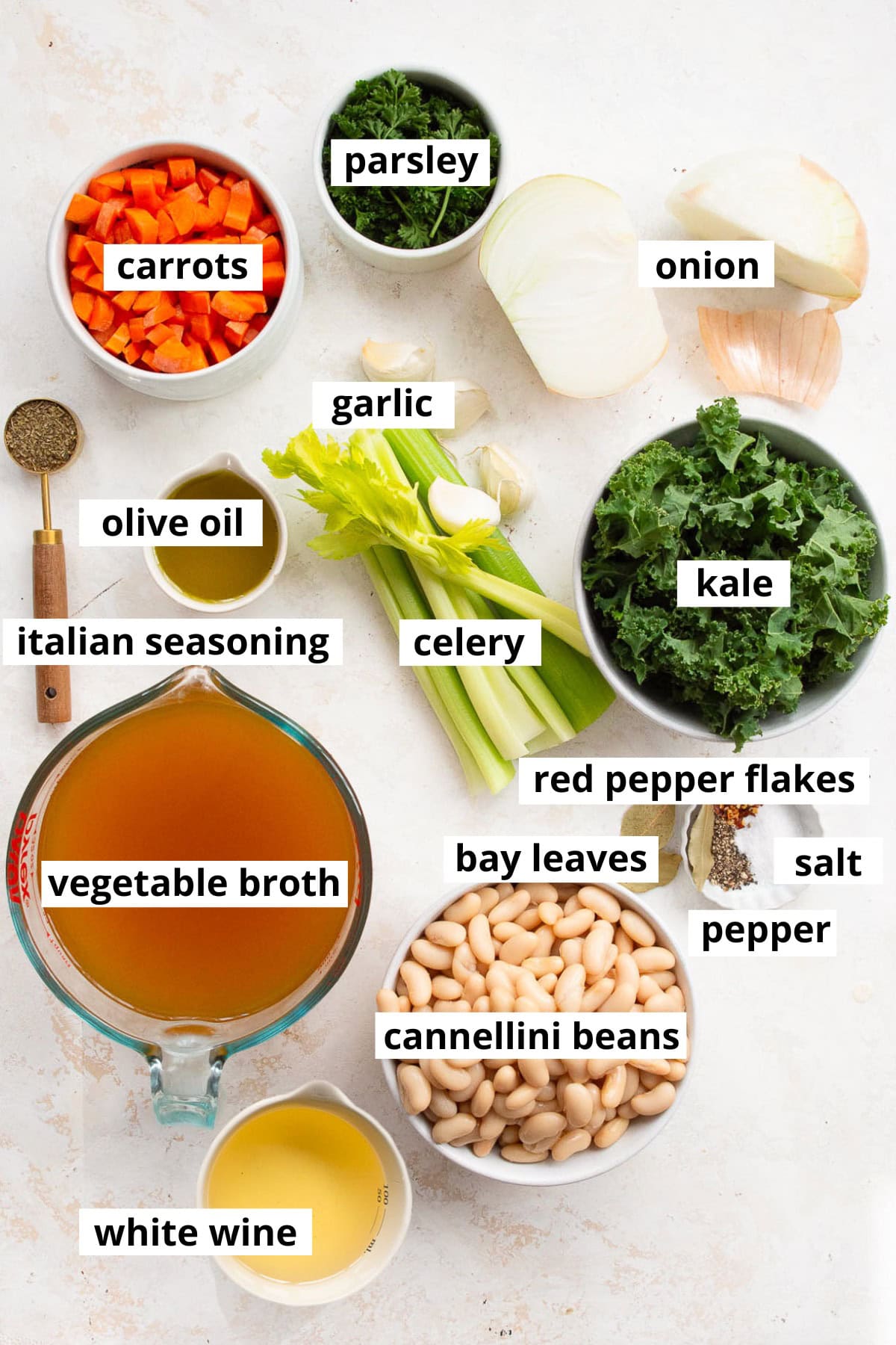 Cannellini beans, carrots, onion, celery, garlic, kale, olive oil, italian seasoning, red pepper flakes, salt, pepper, white wine, parsley.