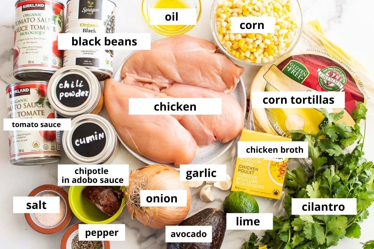 Chicken breasts, corn tortillas, tomato sauce, corn, oil, black beans, chili powder, cumin, chipotle in adobo, salt, onion, garlic, lime, avocado, cilantro.