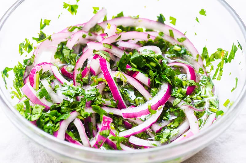 quick pickled onions in a glass bowl for Instant Pot carnitas