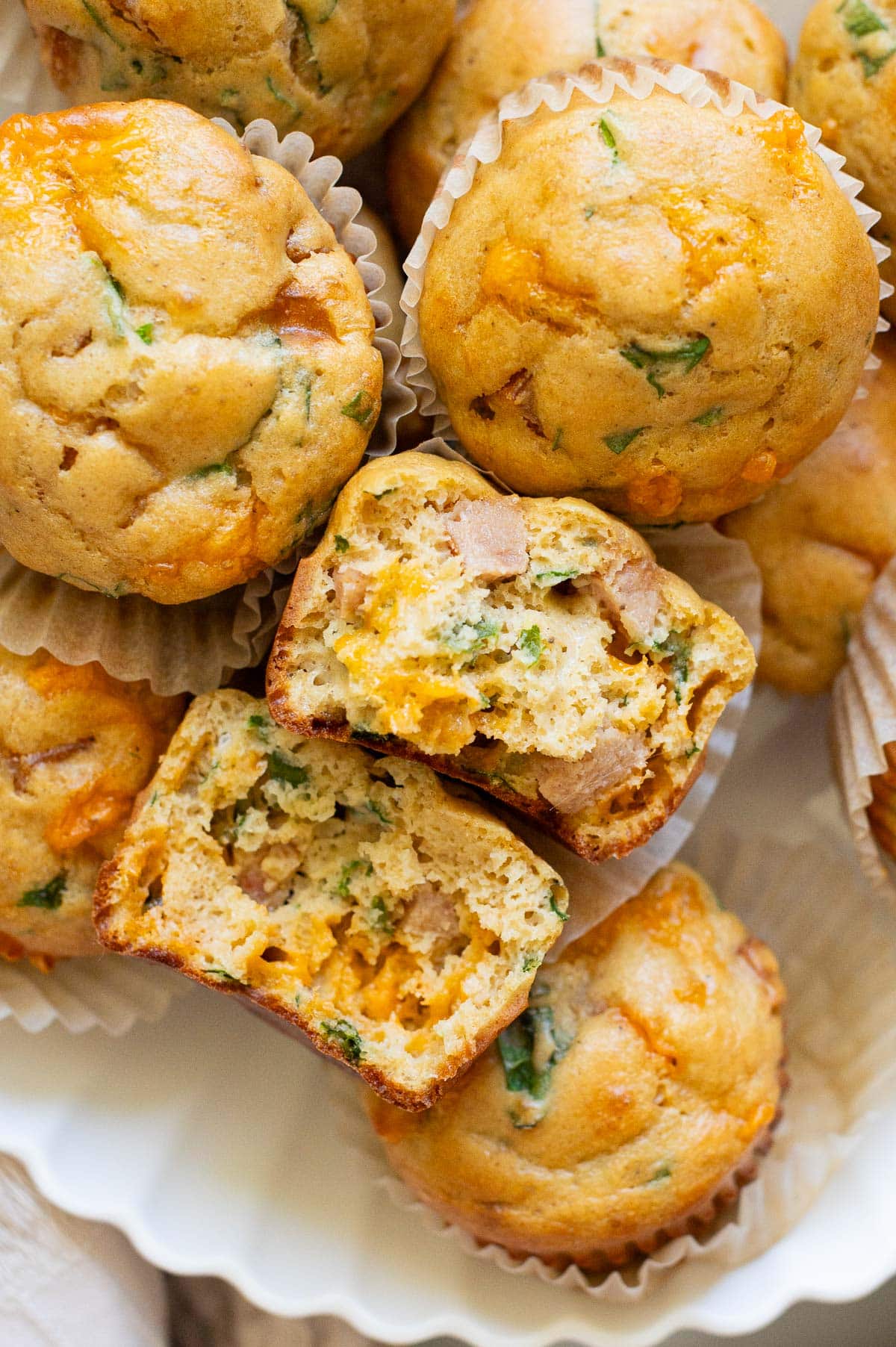 Close up view of one broken muffin showing texture inside.