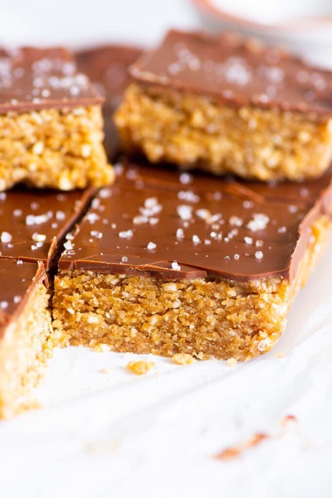 no bake chocolate peanut butter bars cut up and sprinkled with salt
