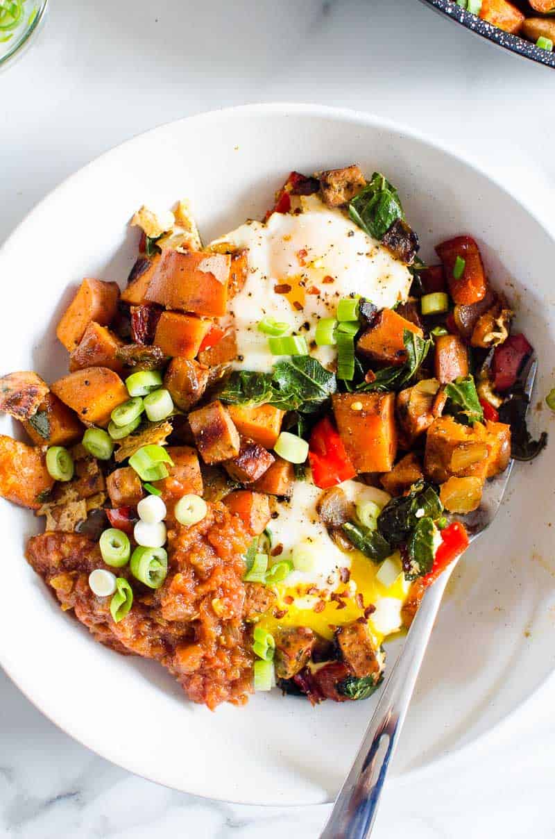Sweet potato breakfast hash served in a bowl with fork.