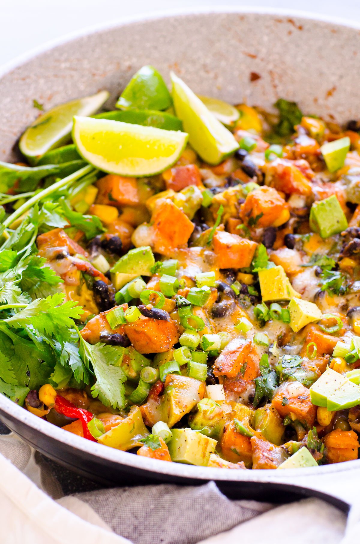 Sweet potato skillet with beans, avocado and cheese.
