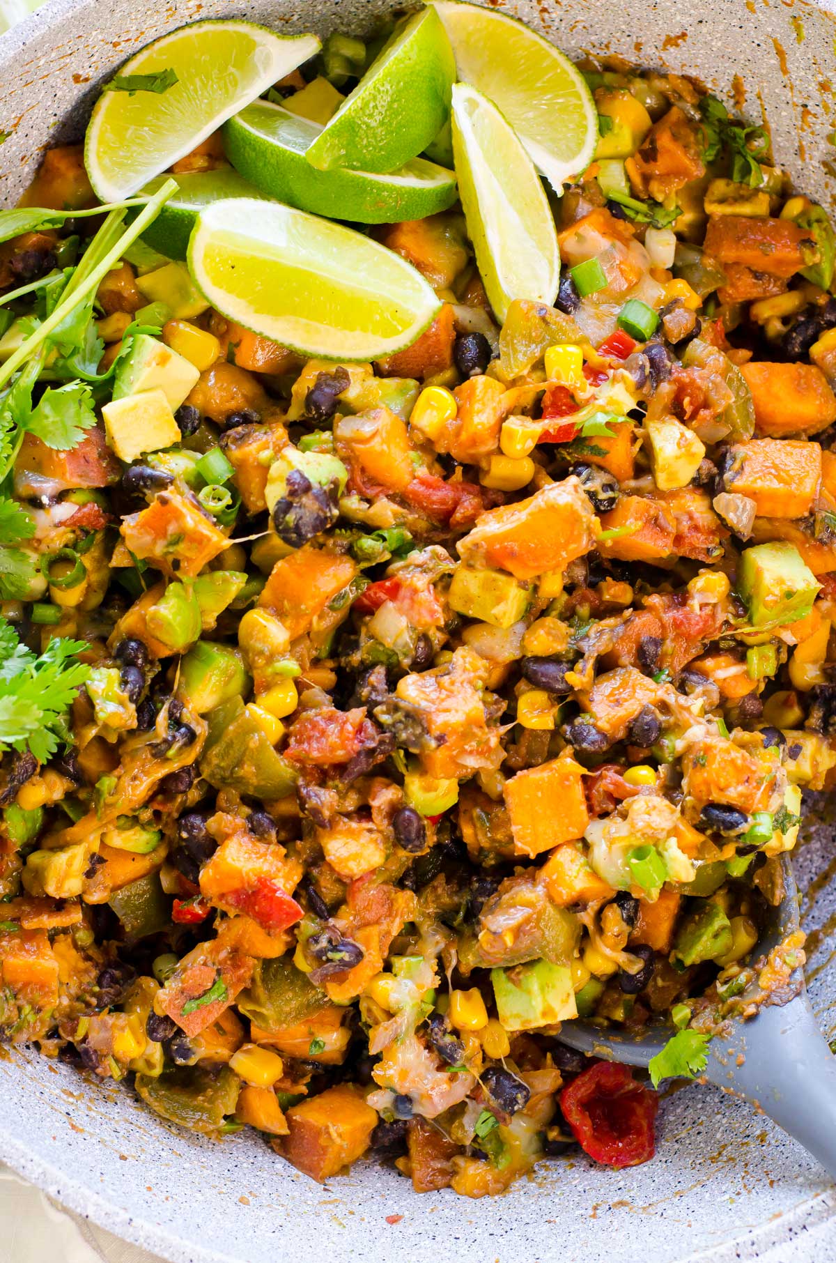 Closeup of a sweet potato skillet with a spoon.