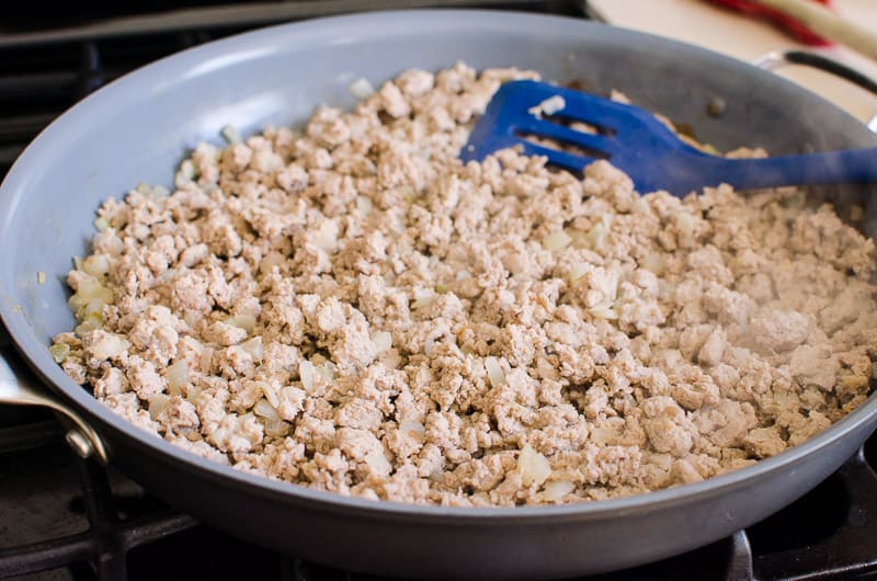 Ground turkey in large skillet.